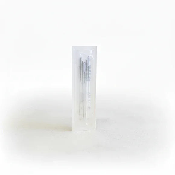 Pack of needles in a clear plastic package on a white background