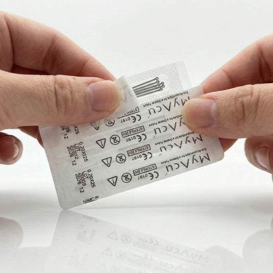 Person holding a MYAQU medical acupuncture needles packaging